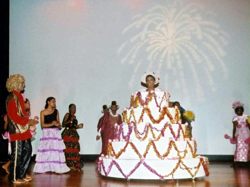 A birthday cake for the 50th anniversary of the Baha'i community of Mauritius was a centerpiece of a performance by youth and children.