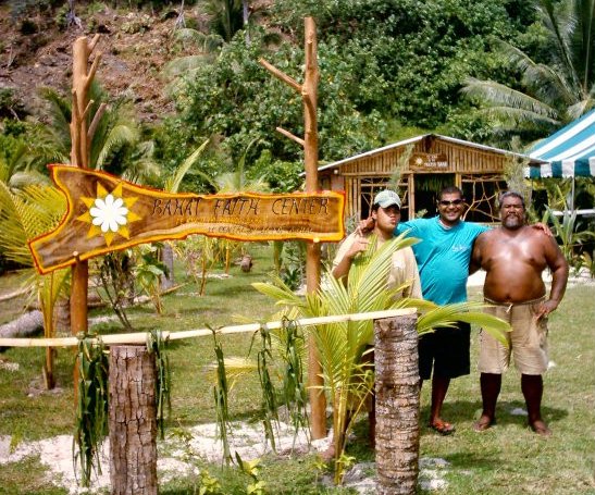 Some local Baha'is pose together in front of the new center.