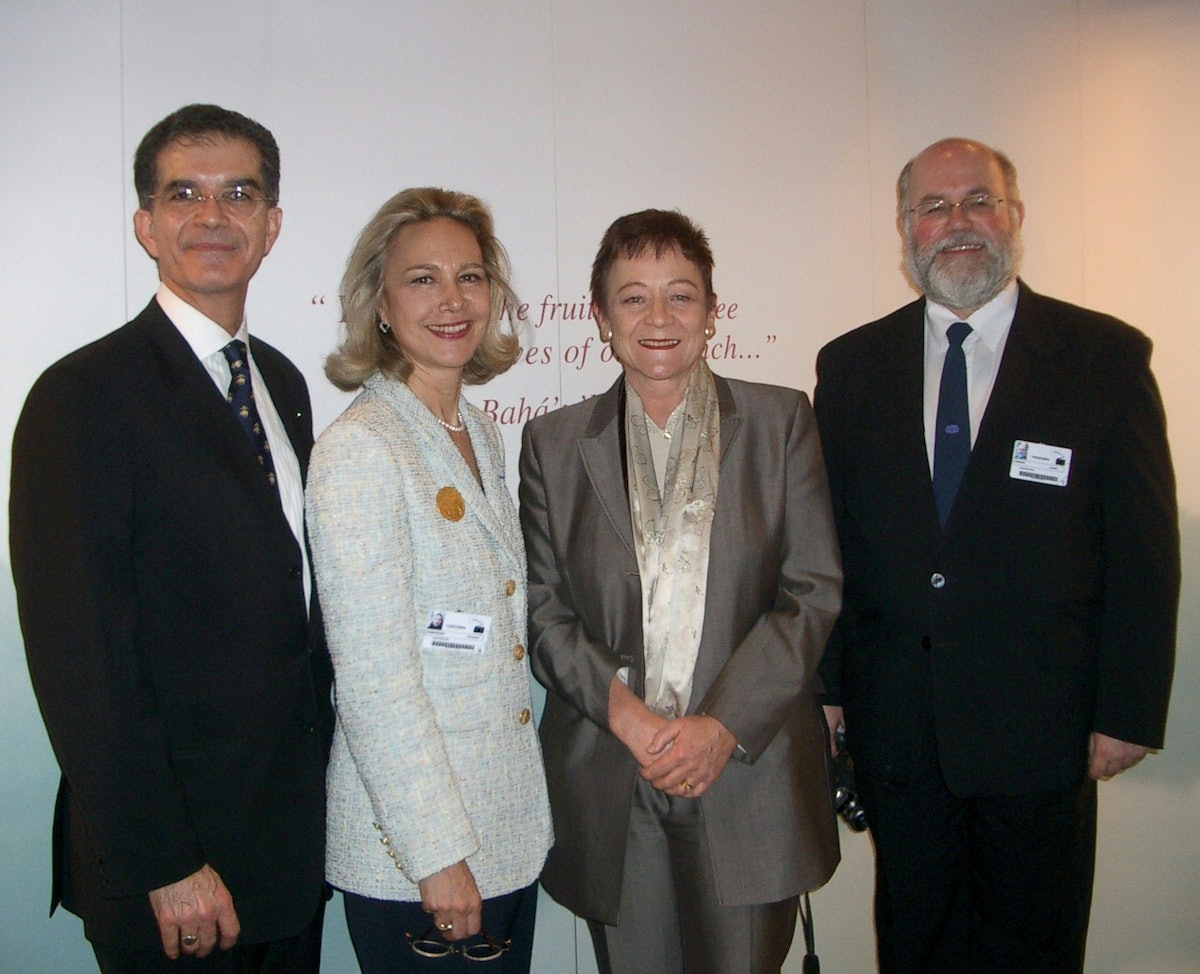 Baroness Sarah Ludford (second from right) standing with Baha'i representatives, Kazem and Christine Samandari (left) and Laszlo Farkas (right).