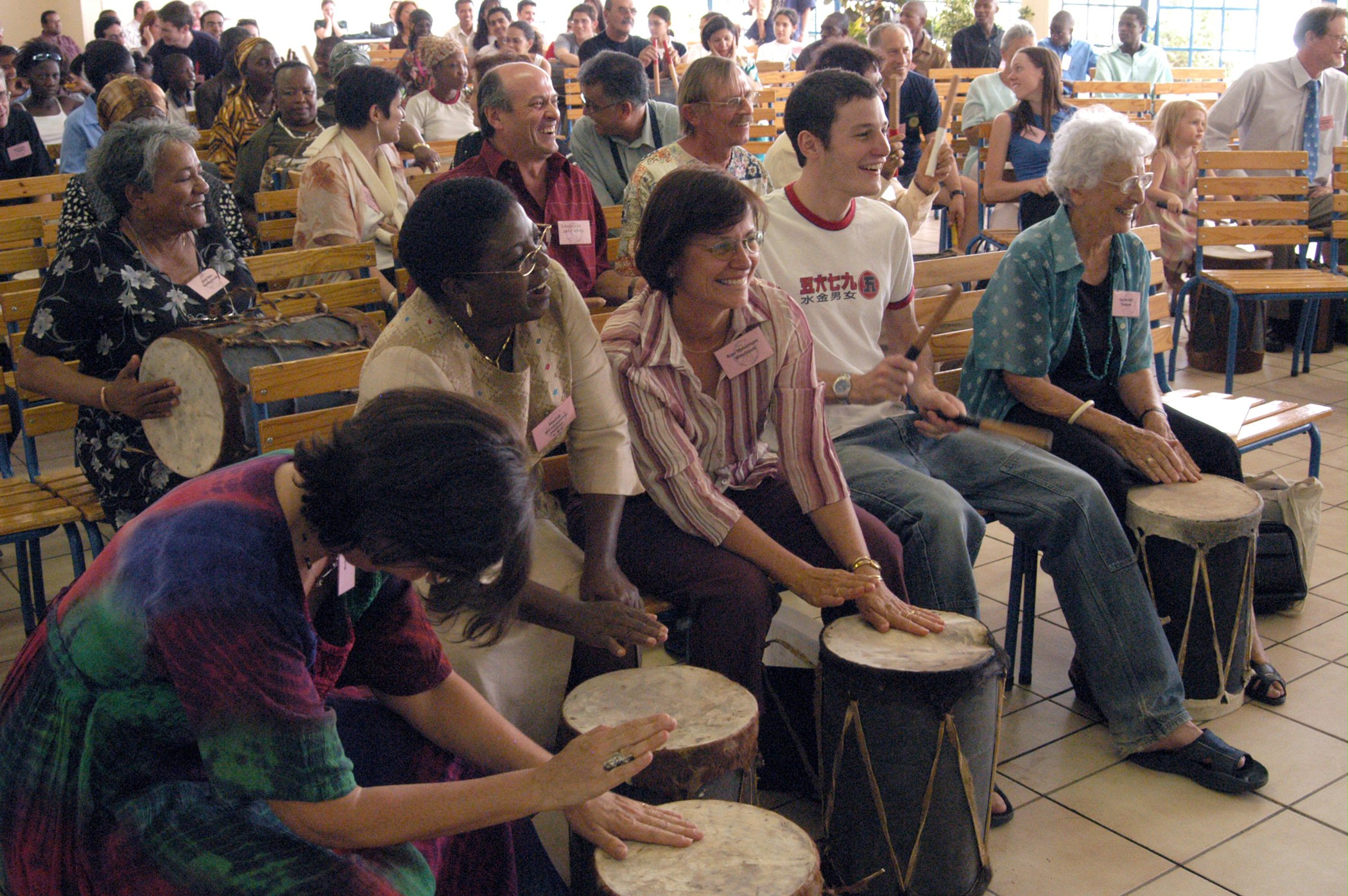 Participants at the jubilee drum in joy and unity.