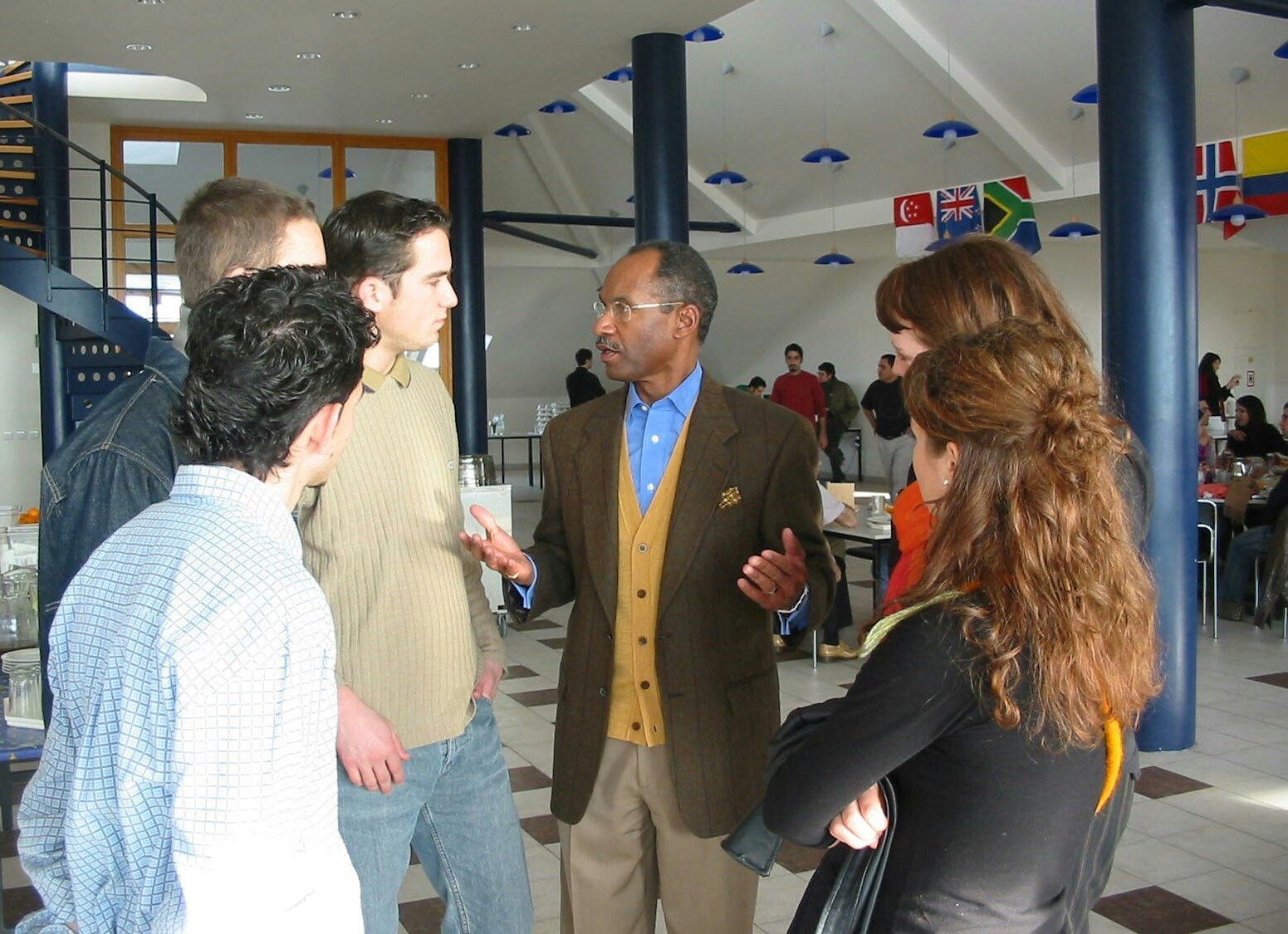 Discussing the finer points...keynote speaker Robert Henderson (center) with some seminar participants.