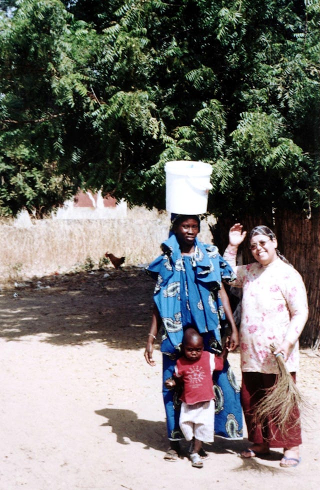 Baha'i traveling teacher Elbahi Aziza (right) visiting local Baha'is.