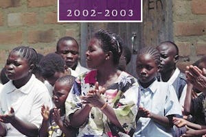 The cover of "The Baha'i World 2002-2003" features Baha'is in Ntambo, Zambia, singing at a devotional gathering.