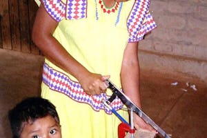 Teacher trainee Lineth Montezuma making items to assist in teaching mathematics.