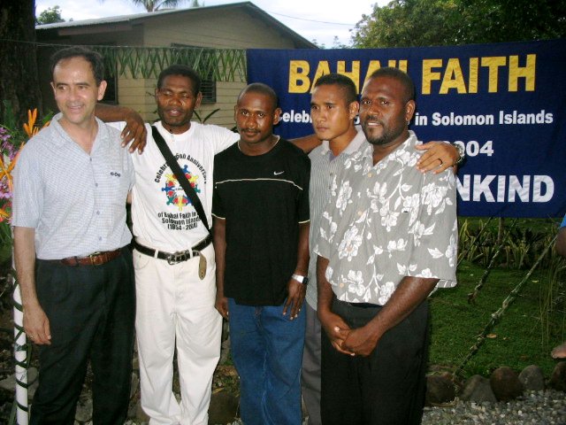 Members of the Local Spiritual Assembly of the Baha'is of Togori, Makira, Eastern Solomon Islands, at the jubilee, with Dr. Mills (at left).