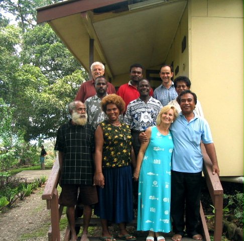 The National Spiritual Assembly of the Baha'is of the Solomon Islands with (at rear right) Dr. Jalal Mills, a member of the Continental Board of Counsellors for Australasia.