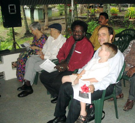 Acting Prime Minister Synder Rini (second from right) with the Mills family.