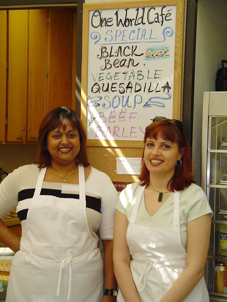 One World Cafe owner Diana Gray (left) with staff member Marina Harbord.