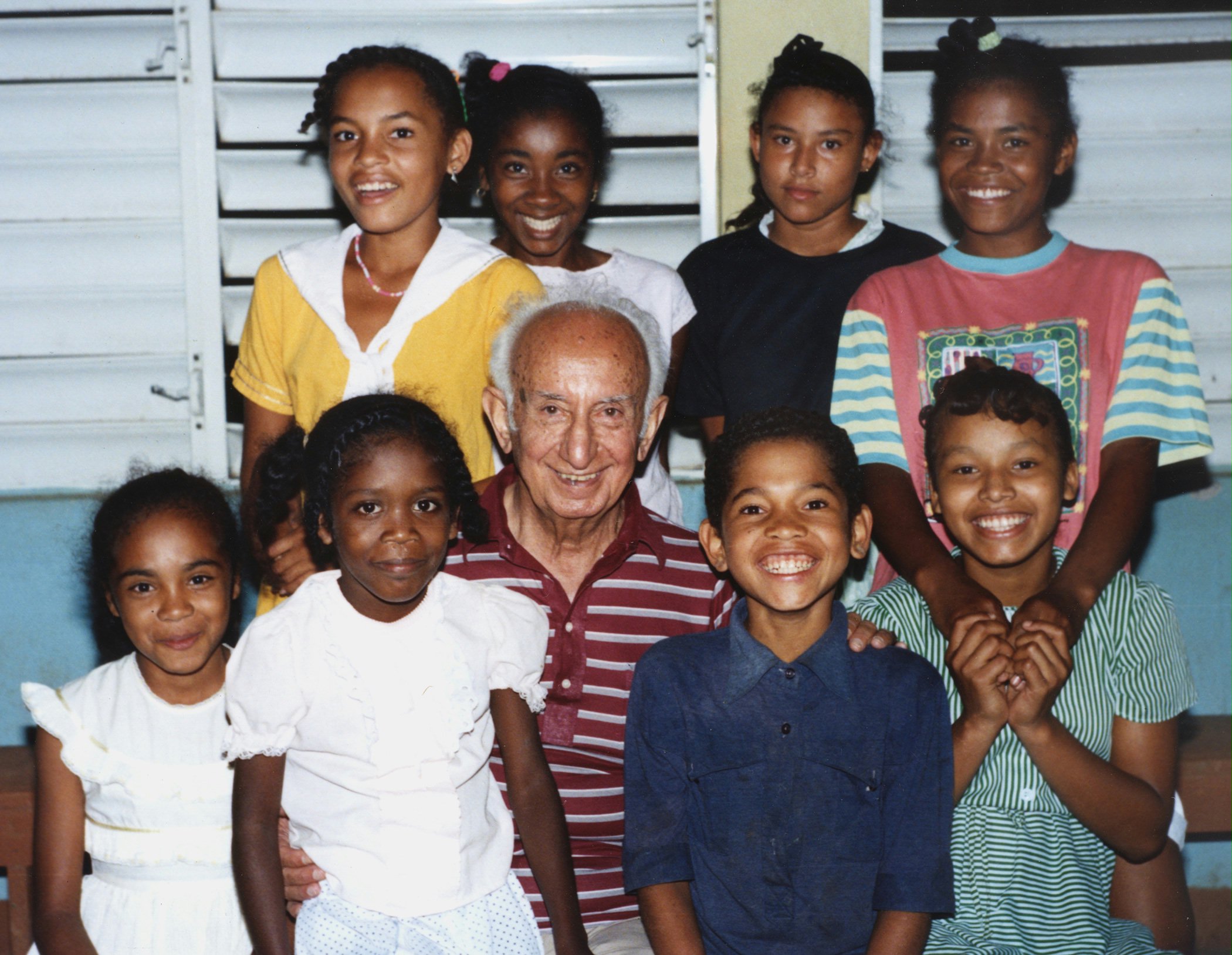 Aziz Yazdi with a group of Carib children and youth, Bataka, Carib Territory, Commonwealth of Dominica, West Indies, 1991.