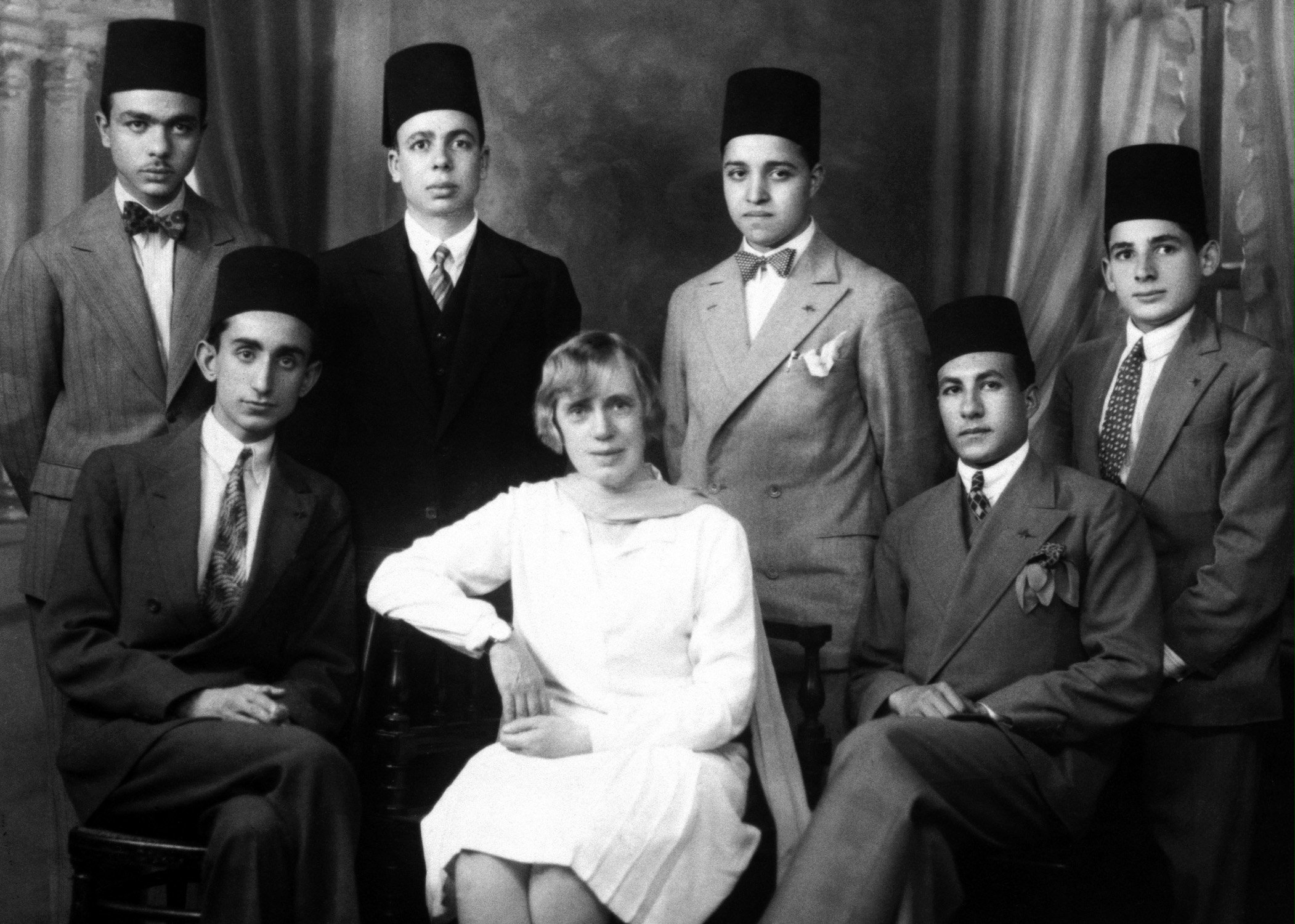 Aziz Yazdi (seated left) with Hand of the Cause Martha Root (center) and Esperanto students, Cairo, Egypt.
