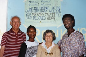 Aziz Yazdi (left) and Mrs. Yazdi (second from right) with Therese and James Elijio, Dominica, West Indies, 1991.