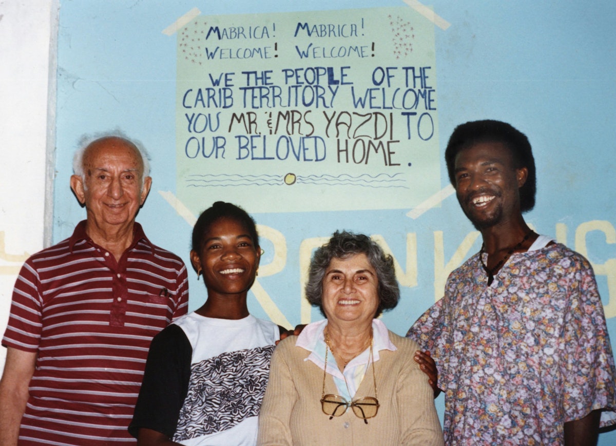 Aziz Yazdi (left) and Mrs. Yazdi (second from right) with Therese and James Elijio, Dominica, West Indies, 1991.