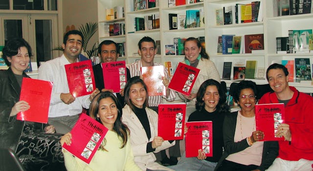 Members of a study circle, who meet at the bookstore, with their workbooks.