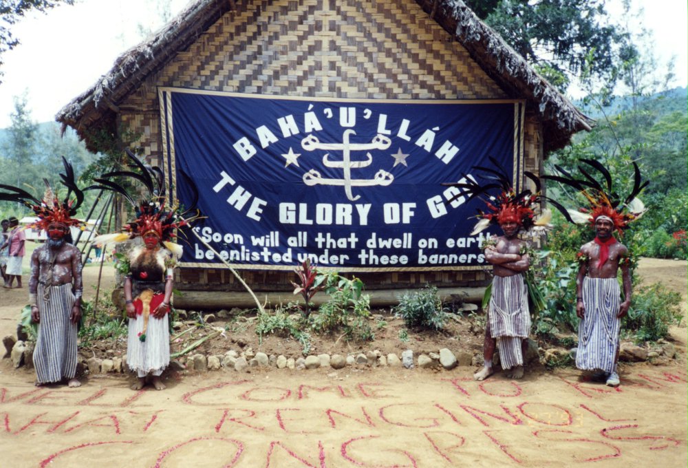 Baha'is with a banner for a Baha'i gathering in the Western Highlands Province of Papua New Guinea, 1993.