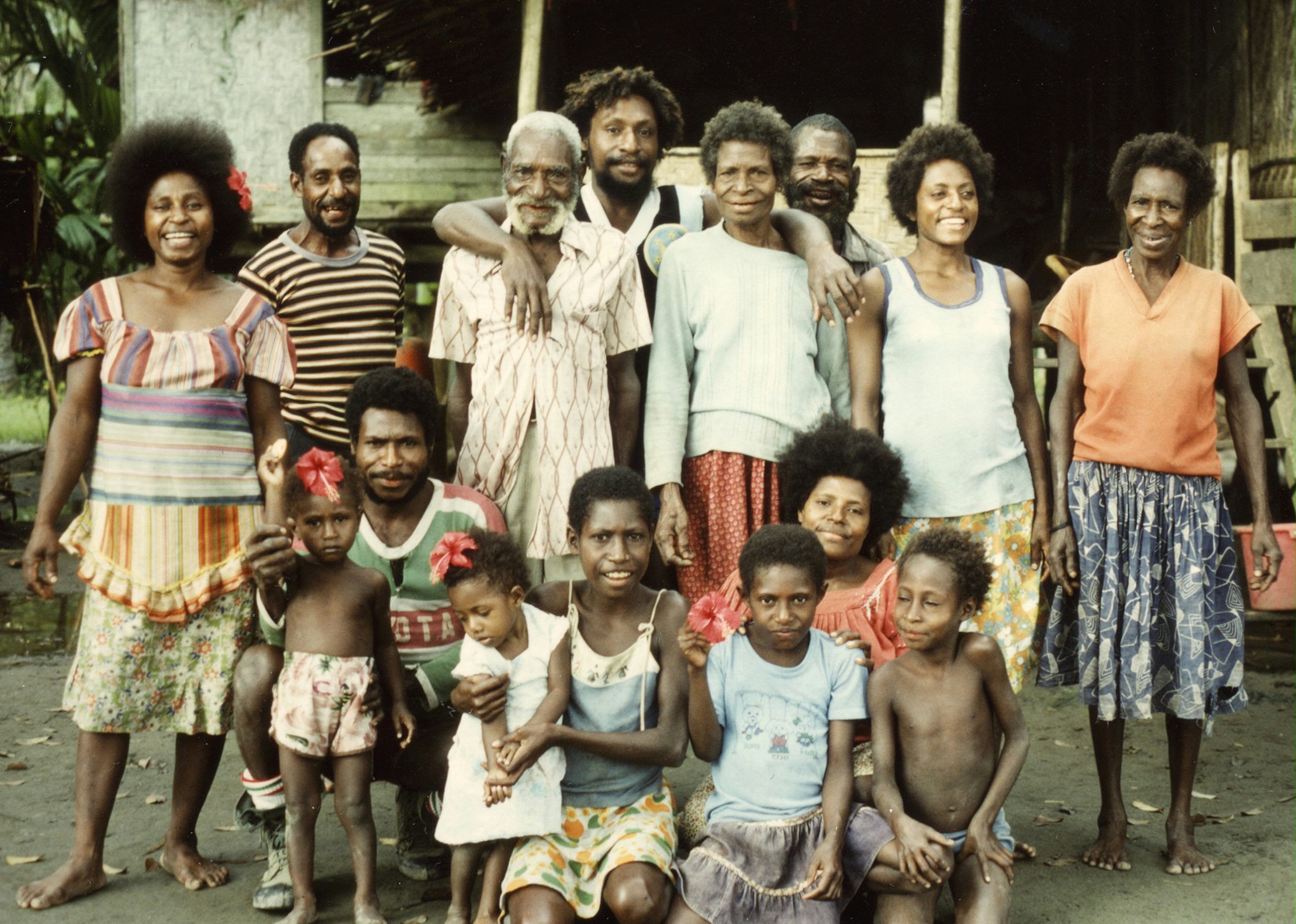 Papua New Guinean Baha'is Kairi Api and his wife, Kivau (center), with family members at Mapaio, 1984.