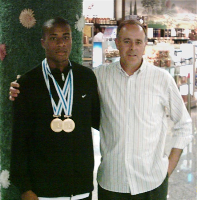 Nelson Evora with his coach, Joao Ganco.