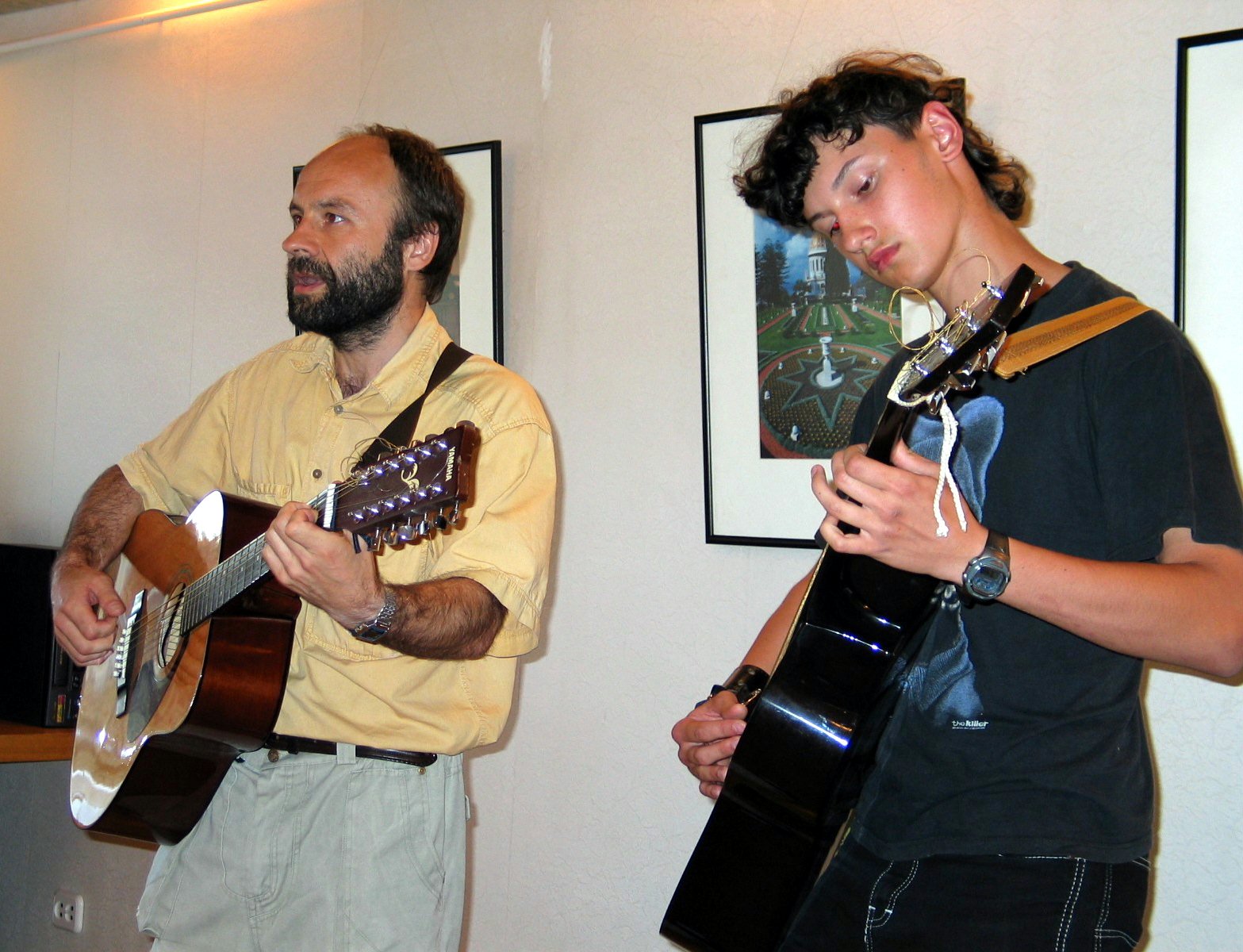 (Left to right) Aleksej Nazarovas, Vladas Mackevic, both of Lithuania, performing at the photo exhibition.