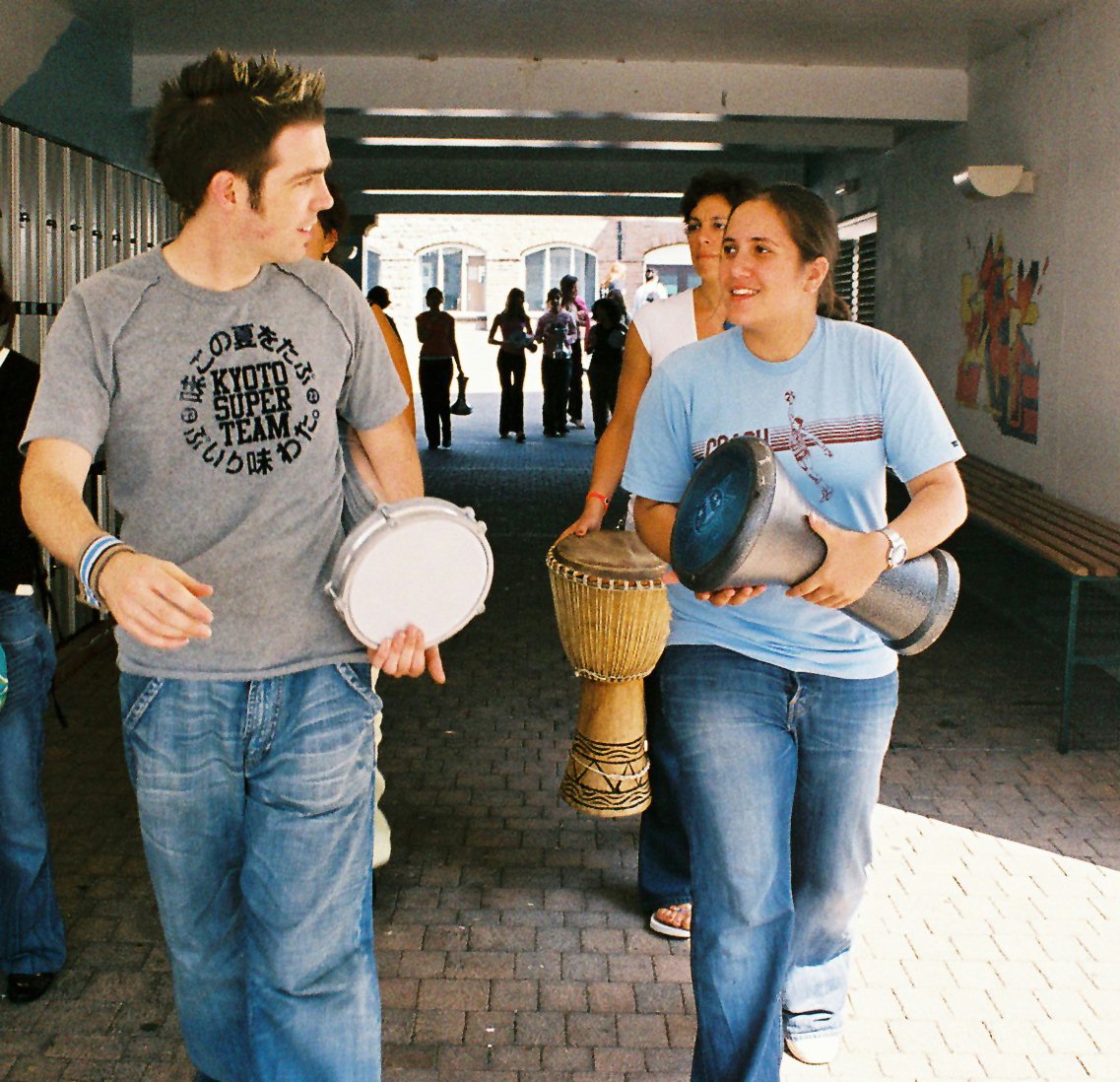 Drumming tutor Oliver Heath (left) with students.