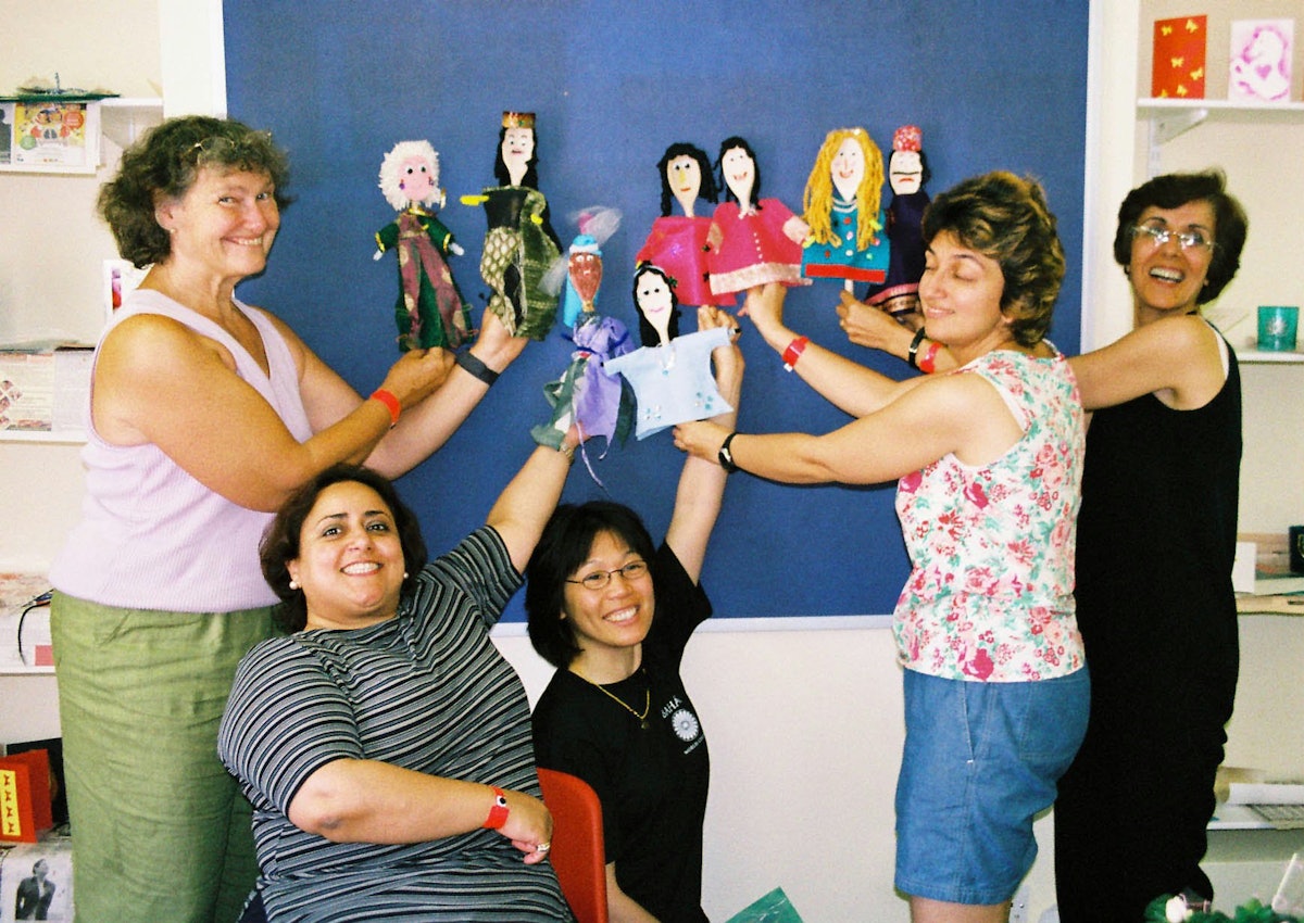 Students display puppets made for use in story-telling in Baha'i children's classes.