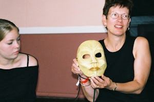 Alison Scrutton (right) displays a mask she used in a performance.