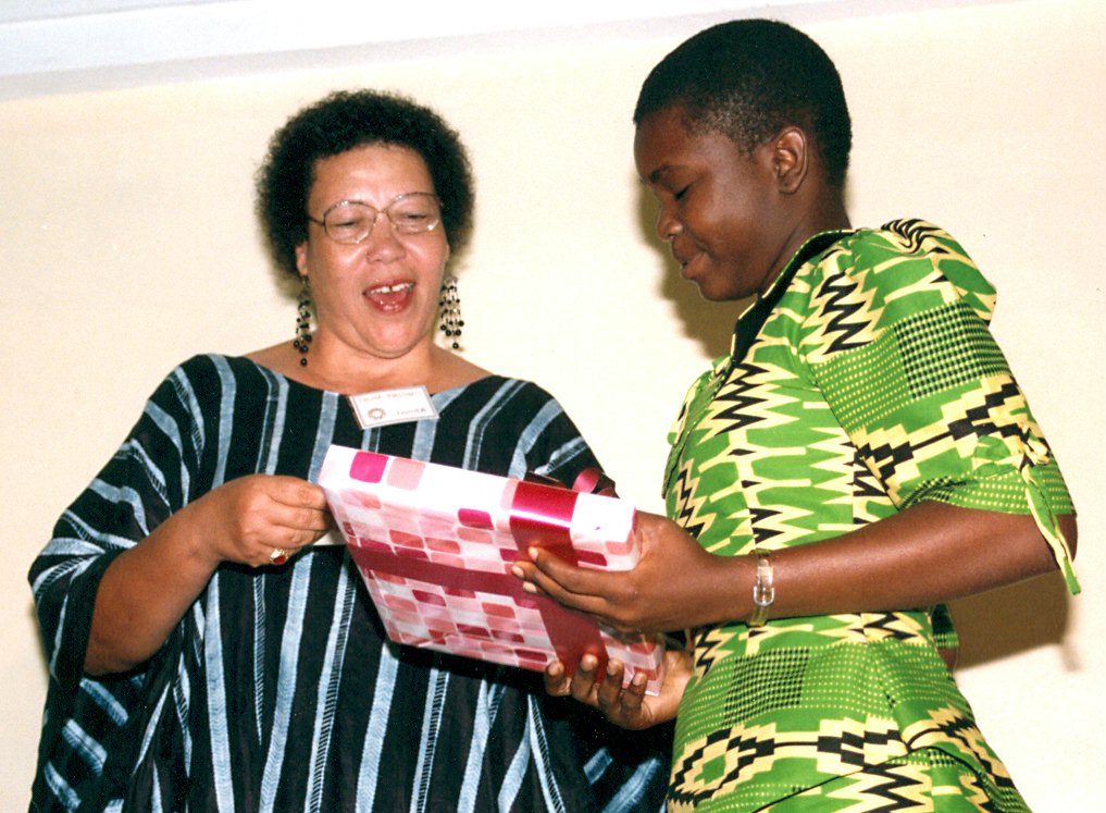 Essay competition...Thelma Khelgati (left) gives a prize to a student during the jubilee celebrations.