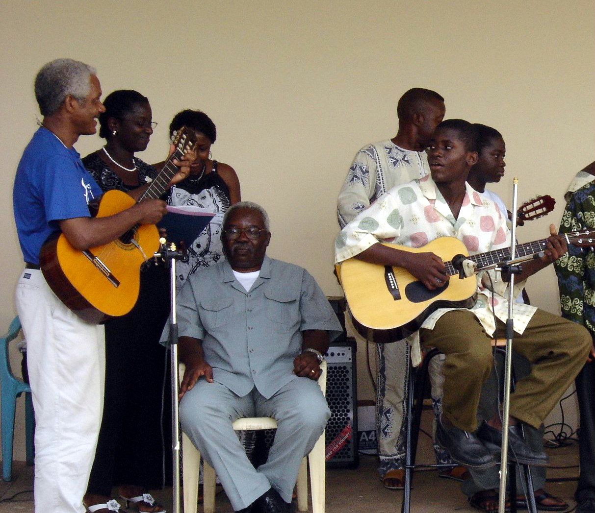 Local Baha'i Pinnock Casely-Hayford (left) and friends during a musical performance at the jubilee.