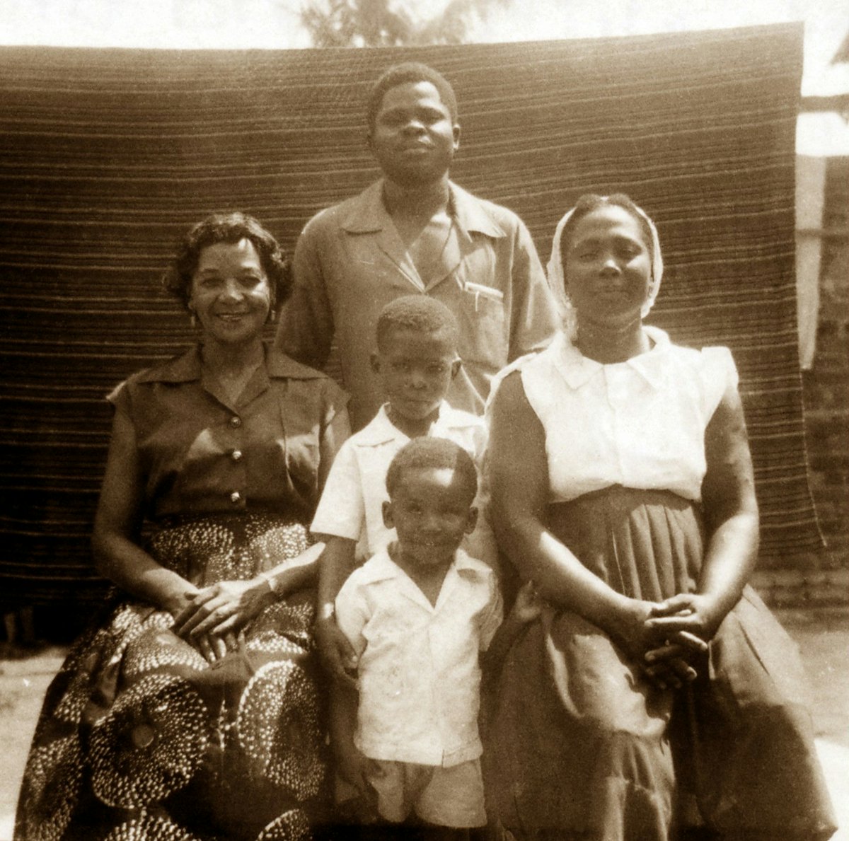 At the Tanyi residence, 1955: Vivian Wesson (left), David Tanyi (standing rear), Esther Tanyi (right), and the Tanyi children, Mbu and Enoch.