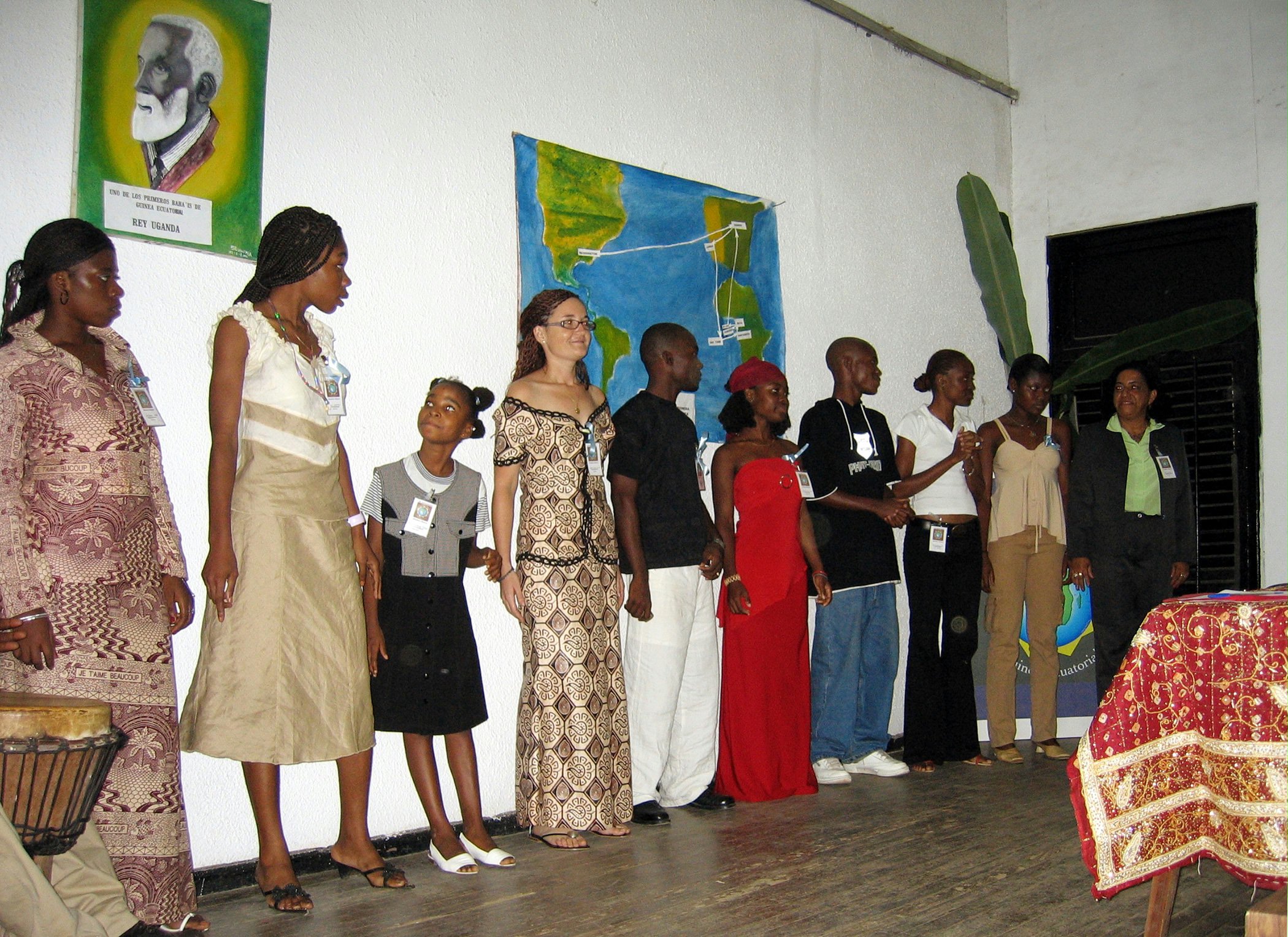 The Baha'i choir of Equatorial Guinea at the celebrations. At left, top, is a picture of King Santiago Uganda.