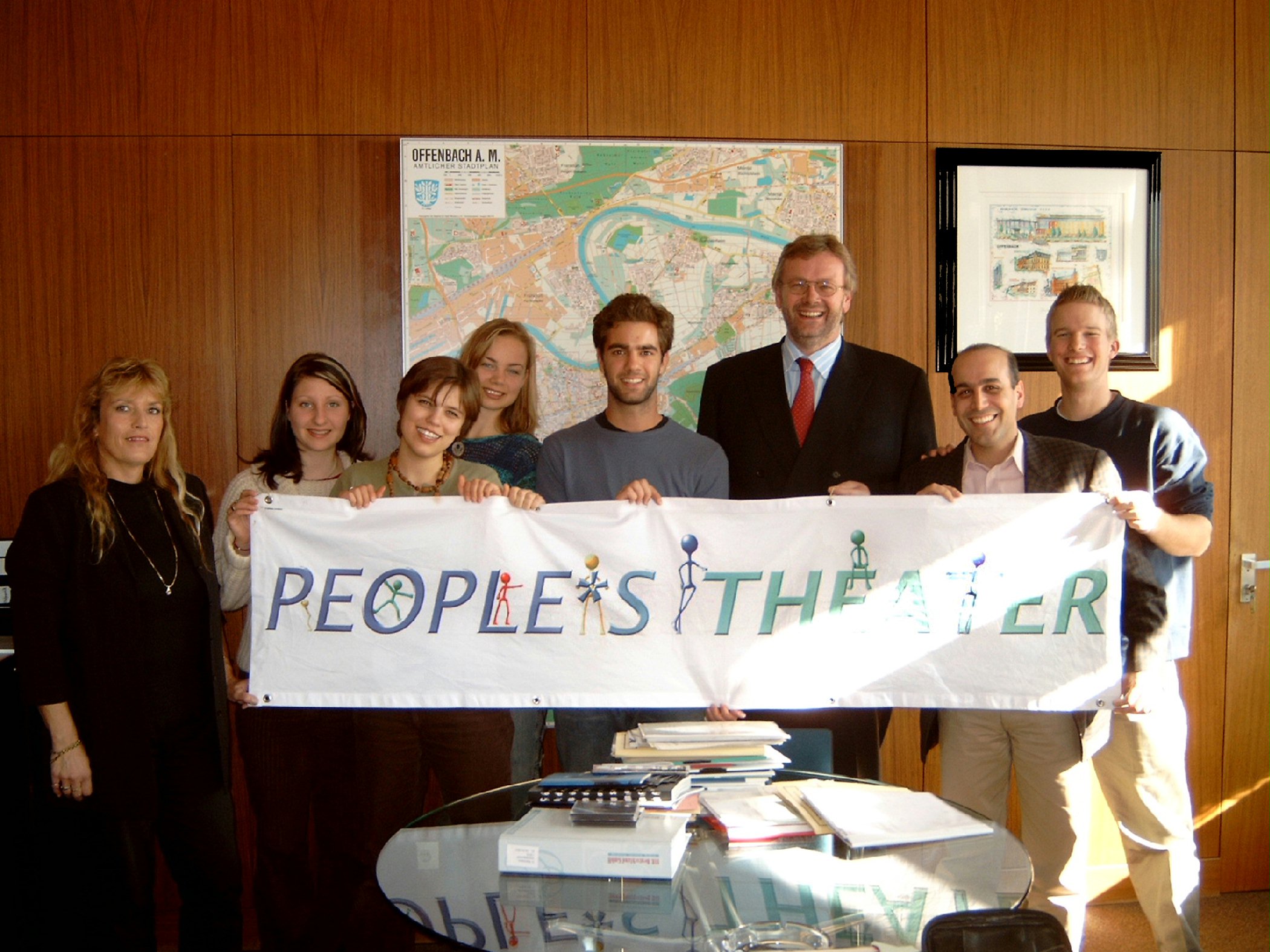 People's Theater representatives, Erfan Enayati (second from right) and Curtis Volk (right), with the mayor of Offenbach, Gerhard Grandke (third from right), and some members of the cast.