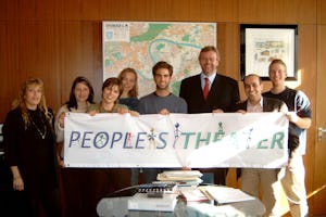 People's Theater representatives, Erfan Enayati (second from right) and Curtis Volk (right), with the mayor of Offenbach, Gerhard Grandke (third from right), and some members of the cast.