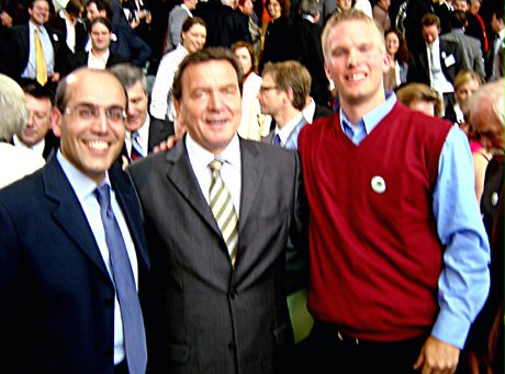German Chancellor Gerhard Schroeder with Erfan Enayati (left) and Curtis Volk (right).