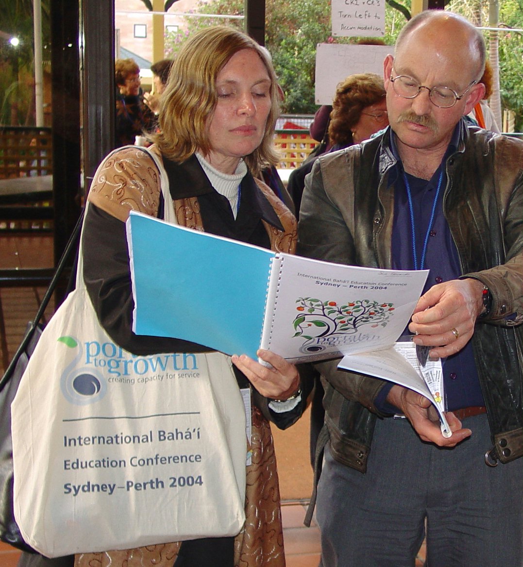 Examining the program at the Portals to Growth conference in Sydney...Sue Edwards (left) and Peter Manins.