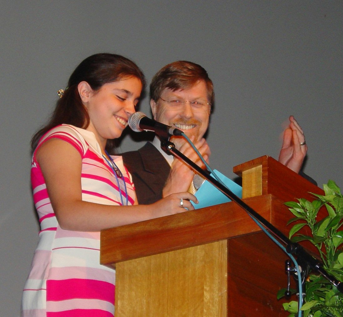 Vienna Norouzi, 11, with Eric Kingston, a member of the National Spiritual Assembly of the Baha'is of Australia.