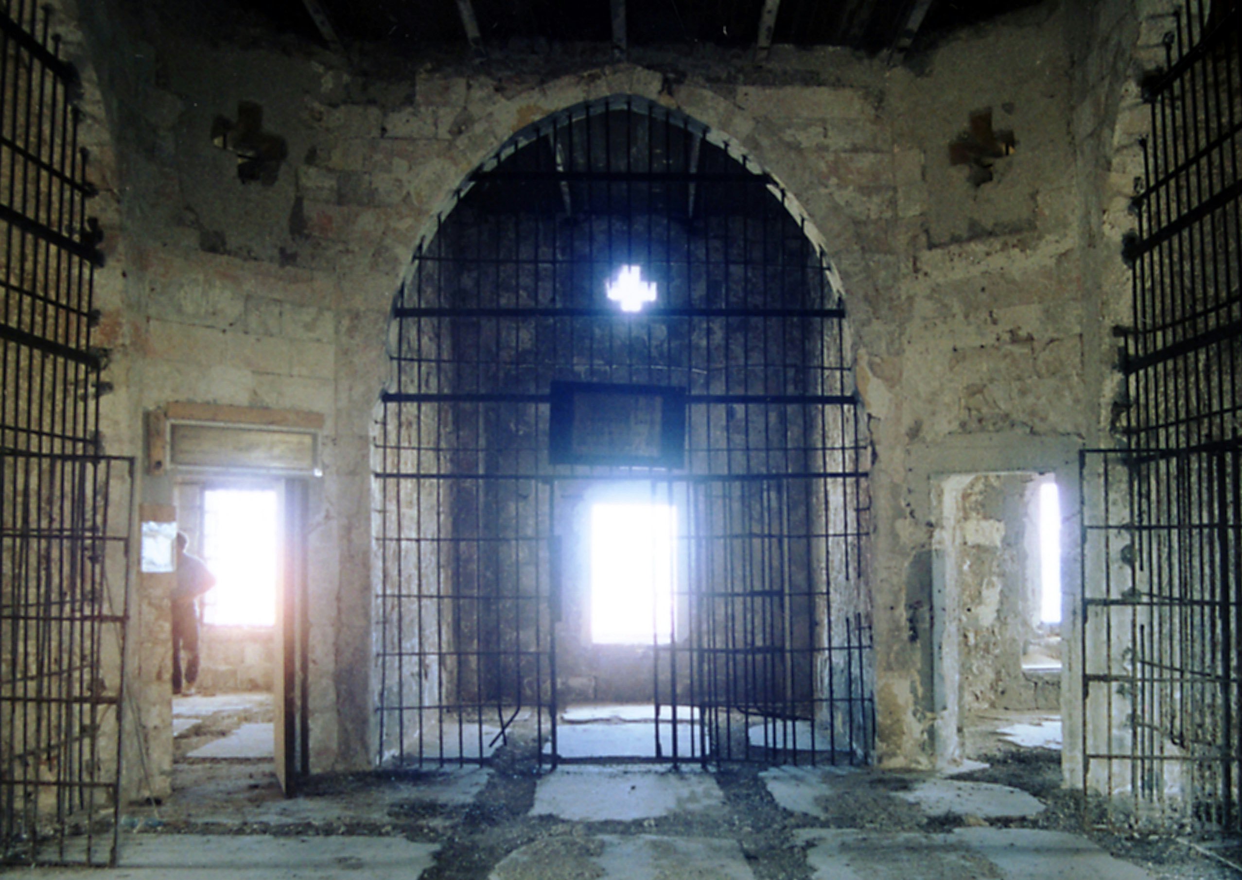 The upper floor about the time the restoration project began. The grilles and square doorframes were installed in 1947.