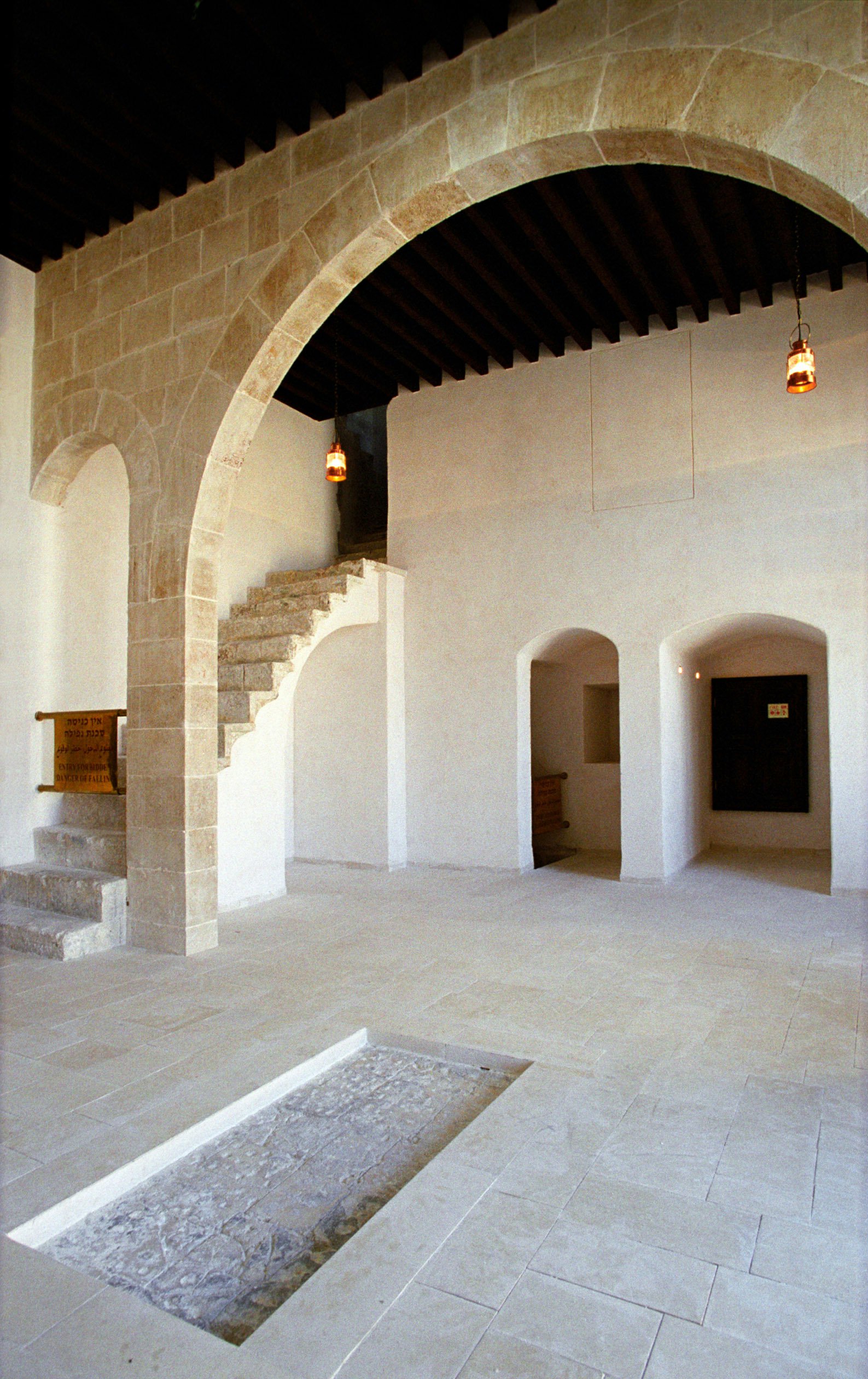The original stone below the historic skylight. The stairs leading to the roof are at rear left. (2004)