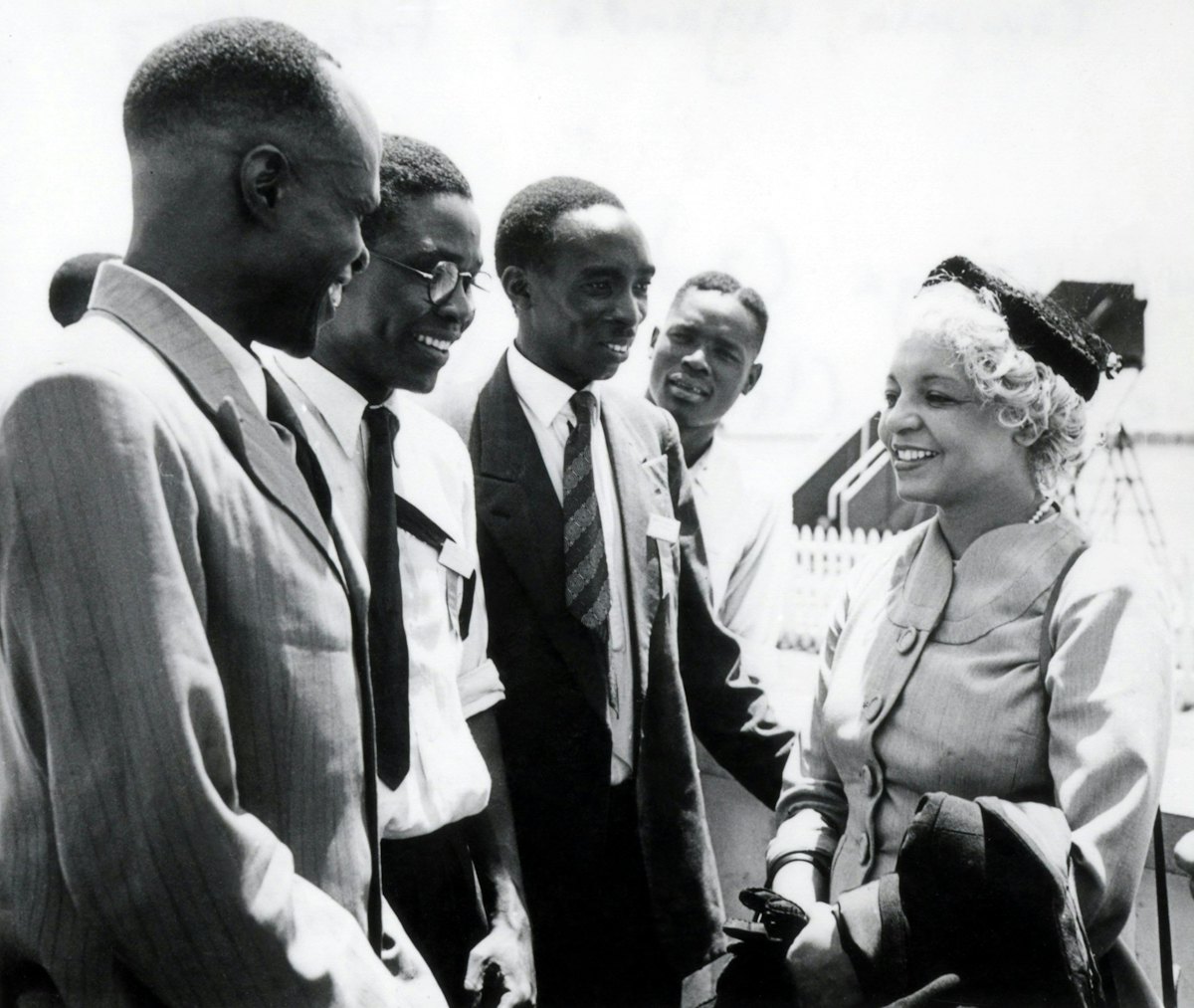 Enoch Olinga, later to be appointed a Hand of the Cause of God (second left), and Elsie Austin (right) with other Baha'is at the African Intercontinental Baha'i Conference, Kampala, Uganda, 1953.