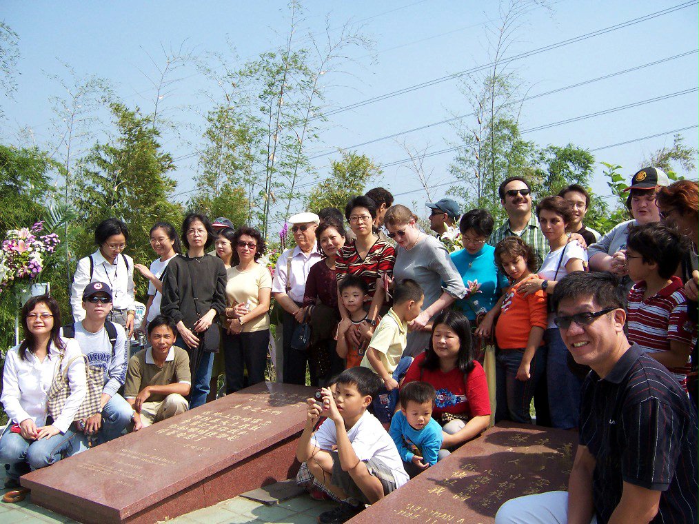Baha'is at the graves of Mr. and Mrs. Suleimani after the anniversary prayer gathering, 2004.