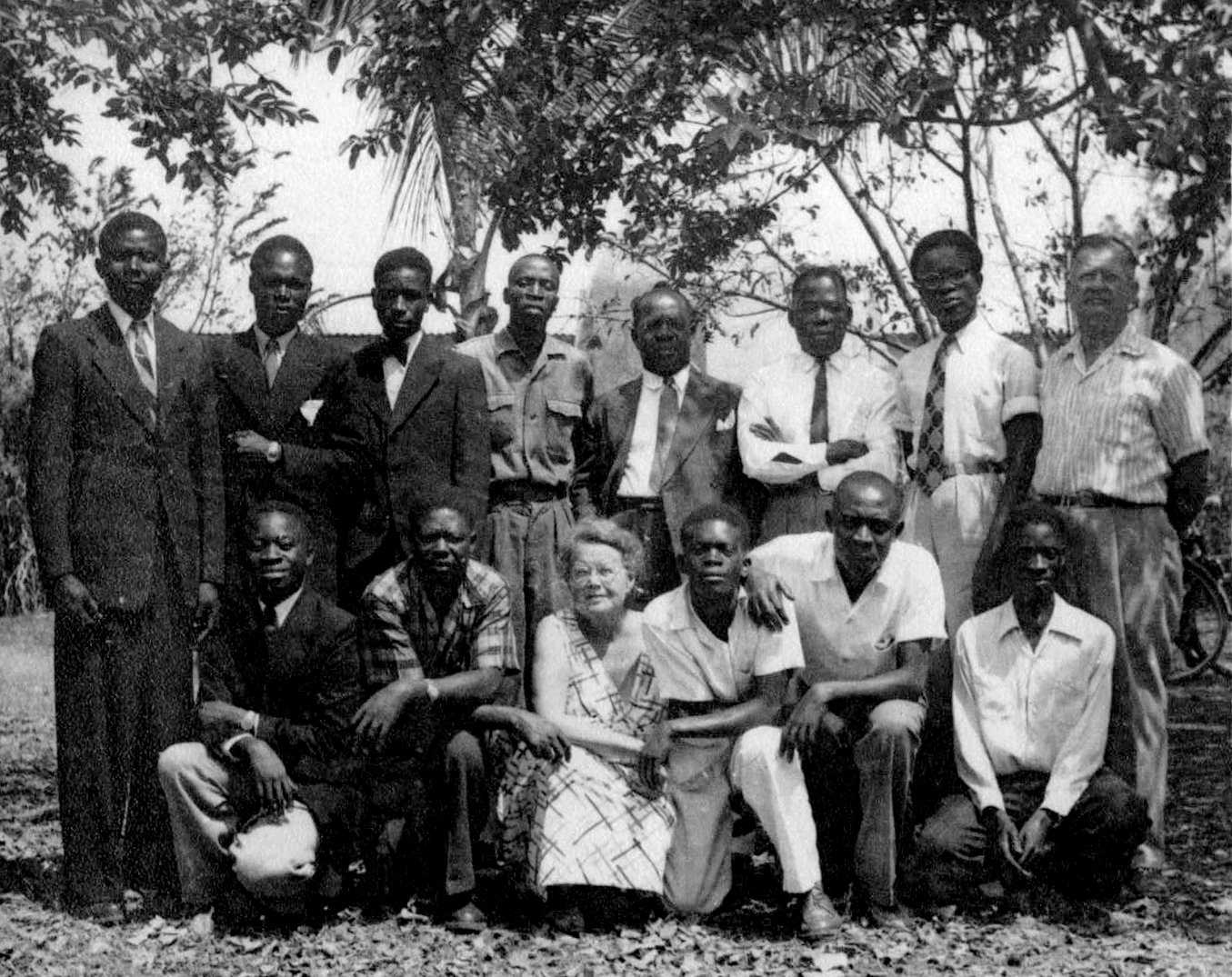 Some of the first Baha'is of Burundi with Mary Collison (front, center) and Reginald (Rex) Collison (standing, right), two of the three who introduced the Baha'i Faith to the country.