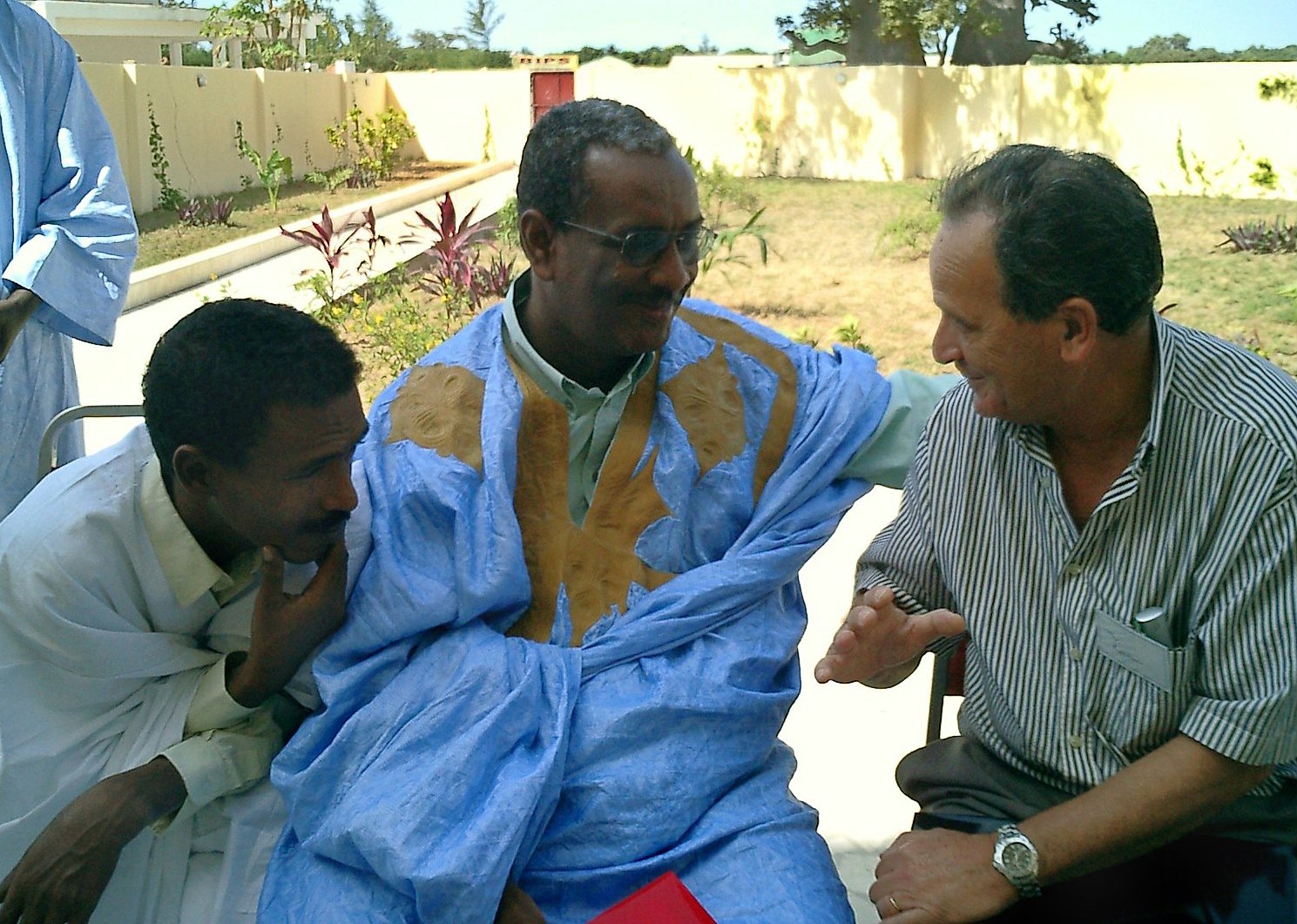 Deep in conversation...Baha'i participants at the festivities in Bakau.