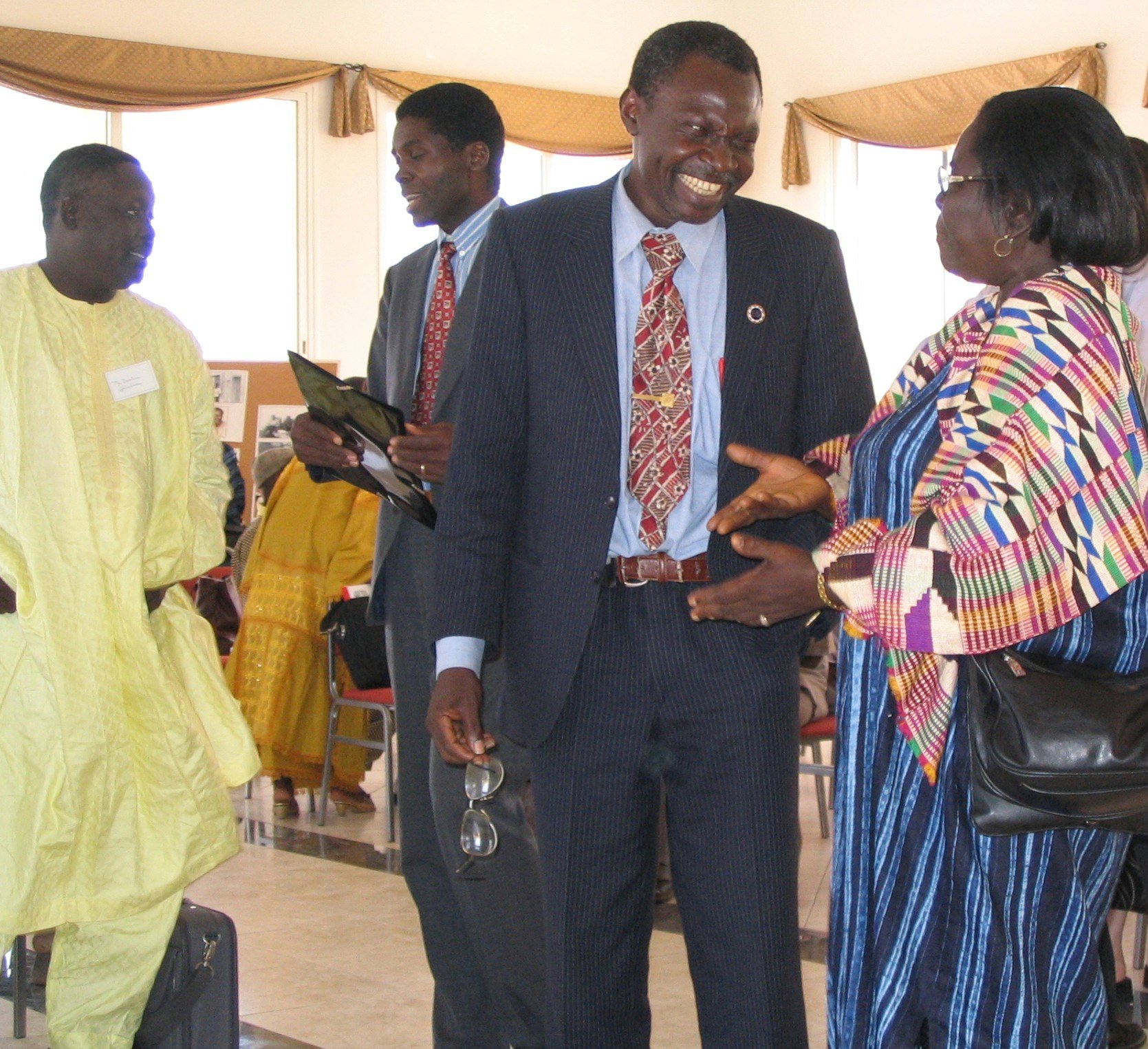 Some members of the Continental Board of Counsellors in Africa during the Baha'i jubilee festivities in The Gambia. (Left to right) Ibrahim Galadima, Tiati a Zock, Clement Thyrrell Feizoure, and Beatrice Asare.