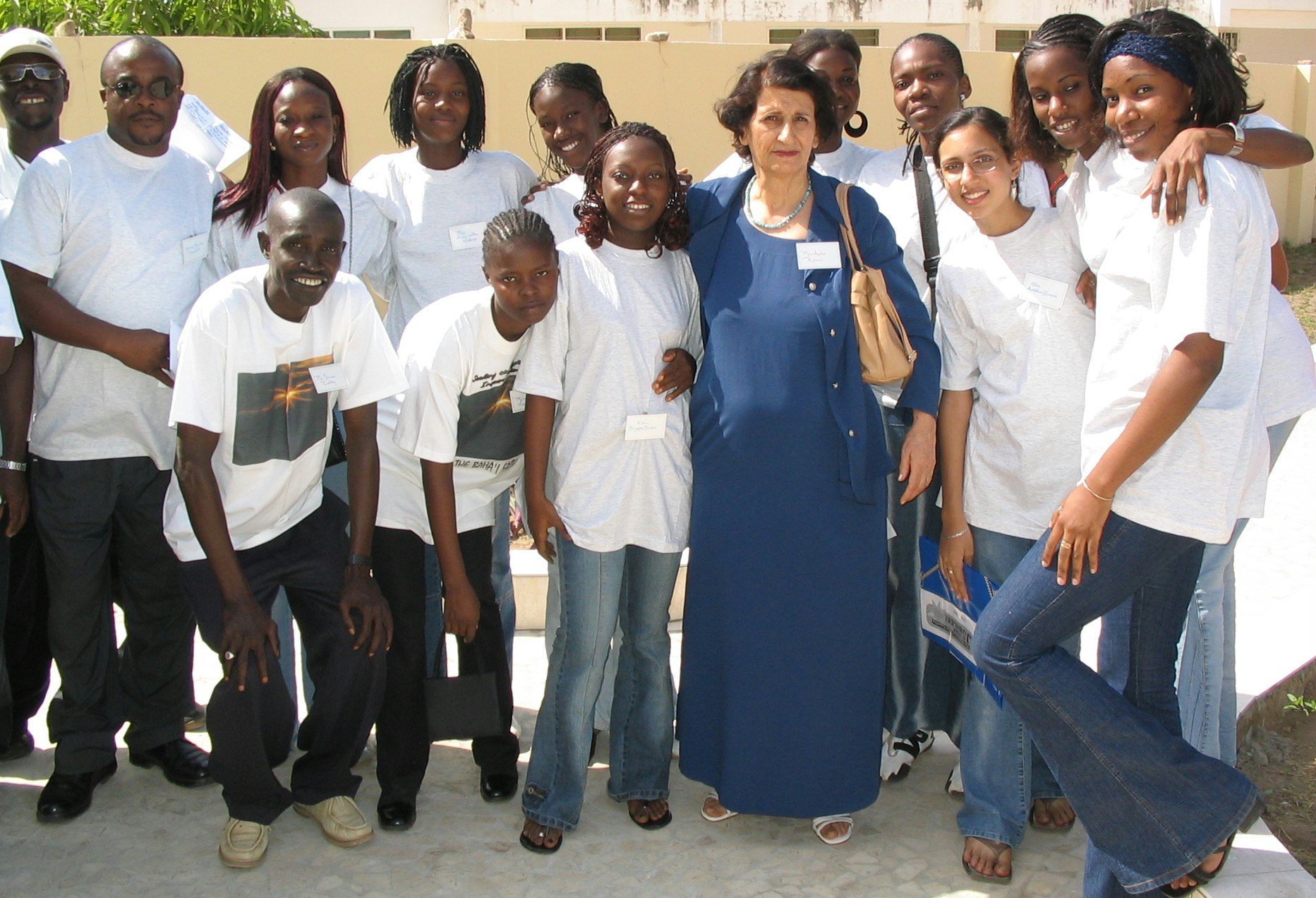Baha'i choir members from The Gambia and Senegal at the jubilee festivities in The Gambia with a jubilee participant, Aqdas Rezvani (in blue gown).