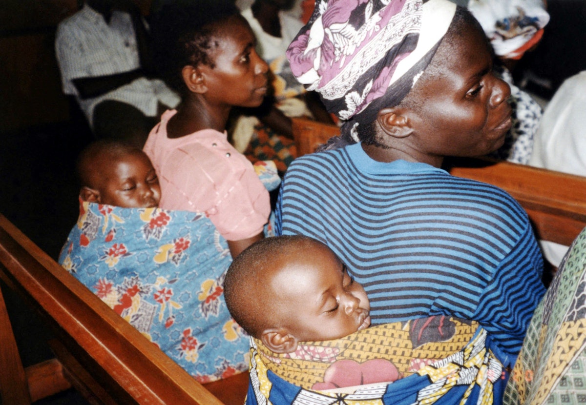 Babies sleep while mothers participate in a Baha'i institute at Kigali, Rwanda, 1997.