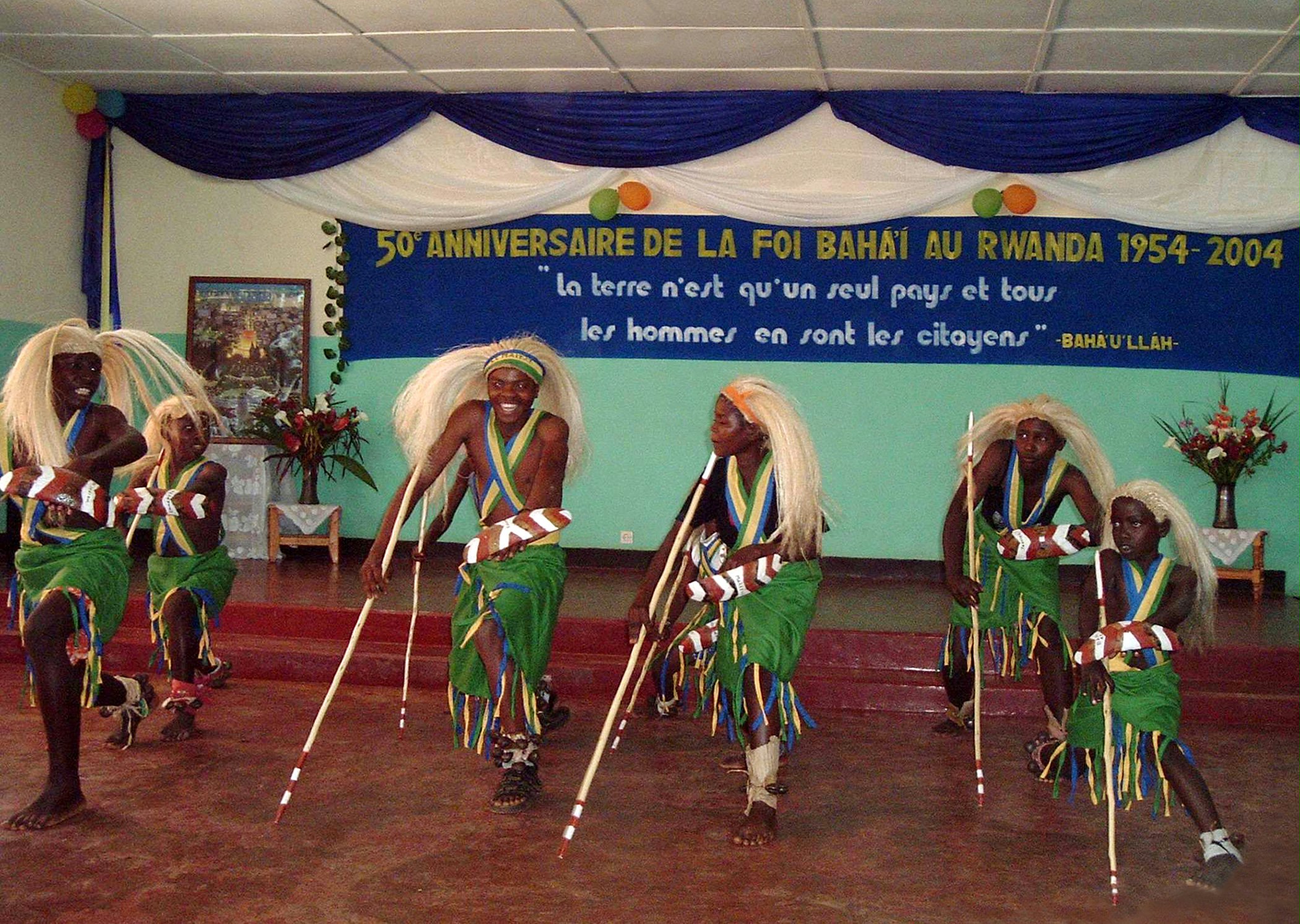A traditional dance from Gatenga was one of the items that prompted joyous participants in the jubilee festivities of the Rwandan Baha'i community to join the performers on the stage