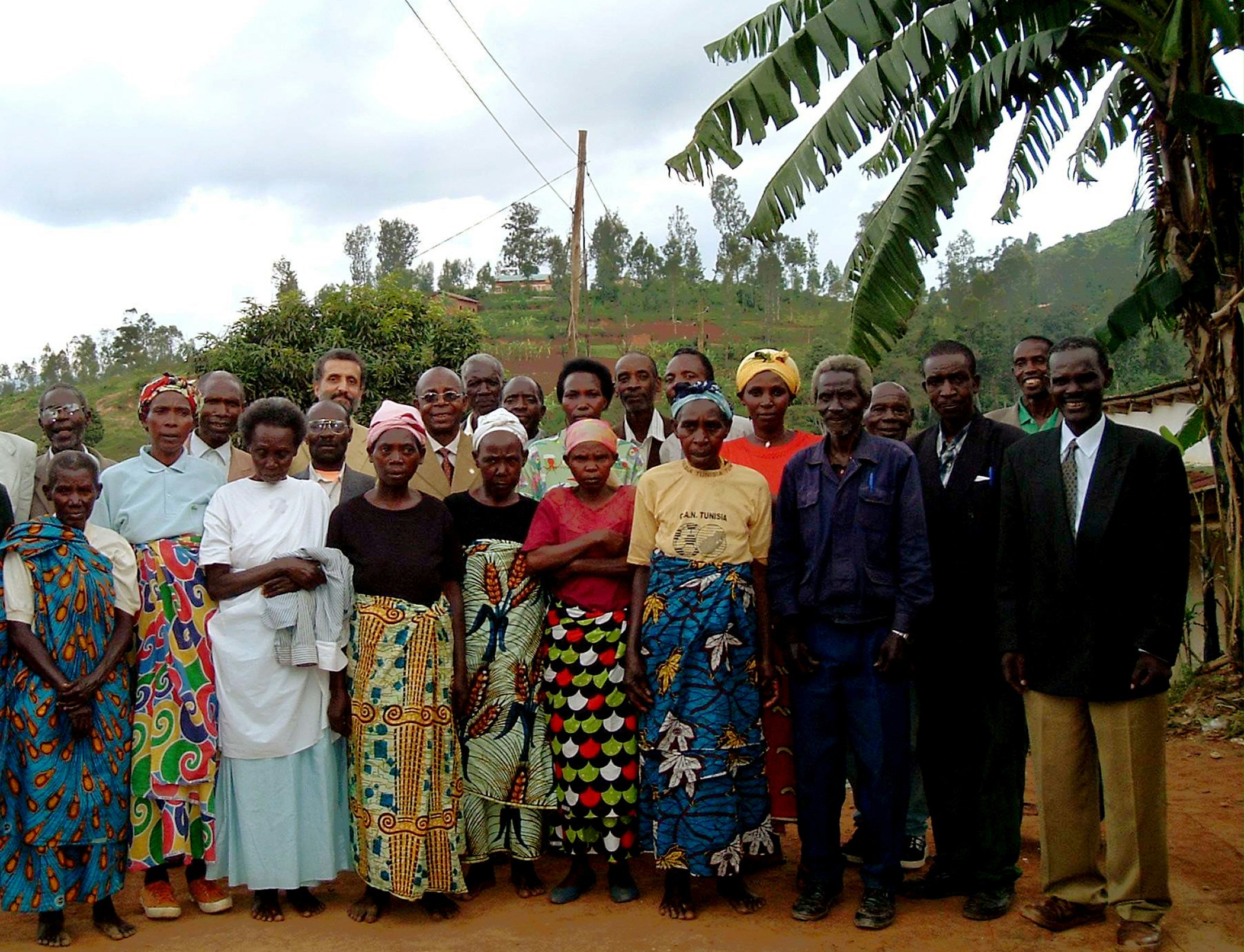 Some of the first Baha'is of Rwanda at the jubilee festivities with a member of the Continental Board of Counsellors in Africa, Ahmad Parsa (seventh from left.)