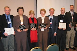 At the award ceremony, 'World Order' managing editor Betty Fisher (fifth from left) and designer Richard Doering (sixth from left).