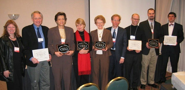 At the award ceremony, 'World Order' managing editor Betty Fisher (fifth from left) and designer Richard Doering (sixth from left).
