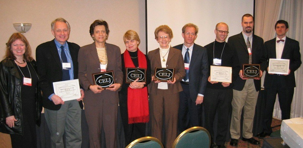 At the award ceremony, 'World Order' managing editor Betty Fisher (fifth from left) and designer Richard Doering (sixth from left).
