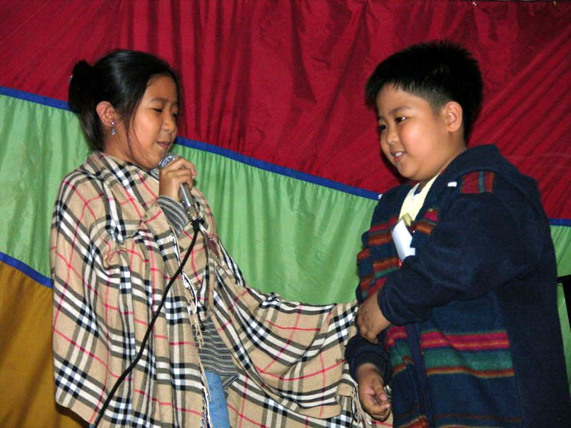 Shanna Aquino Birung (left) and Deje Azamat Laroya Yadao during a dramatic presentation at the Baha'i National Arts Festival in the Philippines.