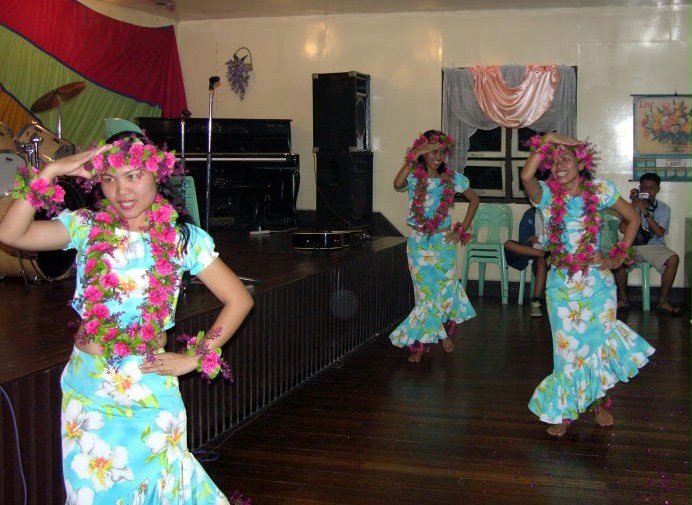 Performing a traditional dance at the Baha'i National Arts Festival in the Philippines: (left to right) Tessie Elisan, Early Soledad, Bebeth Vergara.