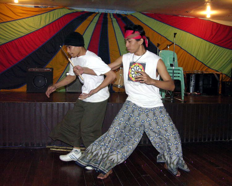 Abner Caya (left) and Quddus Toledo performing martial arts movements at the Baha'i National Arts Festival in the Philippines.